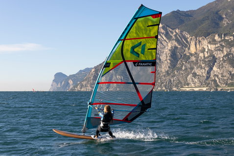 Fanatic Gecko Eco freeride windsurf board during windsurfing on an alpine lake