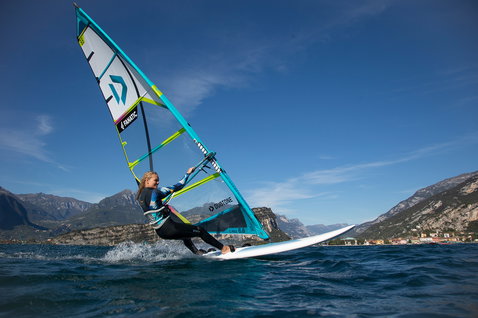 Fanatic Gecko HRS freeride windsurf board during windsurfing on a mountain lake with Duotone sail