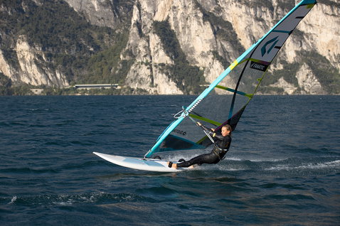 Fanatic Gecko HRS freeride windsurf board during windsurfing on a mountain lake