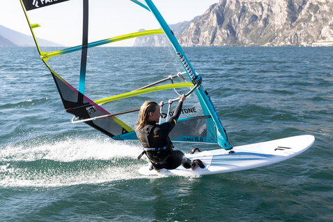 Fanatic Gecko HRS freeride windsurf board during windsurfing on a mountain lake