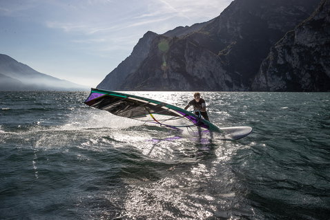 Fanatic Jag LTD windsurf board during windsurfing on Lake Garda with mountain backdrop