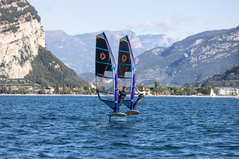 Fanatic Stingray Foil LTD windsurf foil board during foiling on an alpine lake with two riders