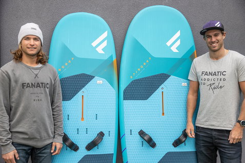 Fanatic Stingray Foil LTD foil windsurf board in teal held by two athletes