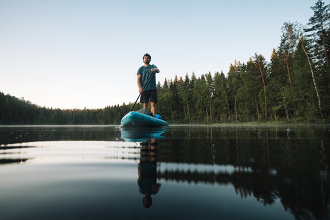 Duotone Ray Air inflatable touring SUP board during stand-up paddling on a Finnish lake