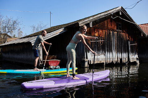 Duotone SUP Diamond Air Touring Pocket inflatable SUP board during SUP touring on an inland lake