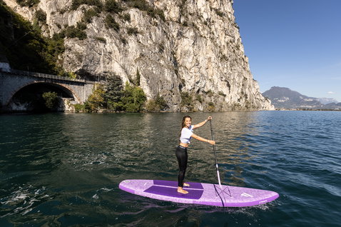 Duotone Diamond Air Touring Pocket inflatable SUP touring board during paddling on a mountain lake