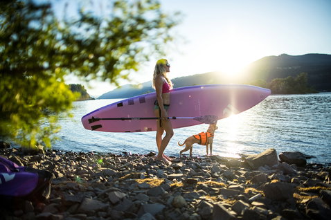 Duotone Diamond Air Touring Pocket inflatable SUP board during lake touring in lavender and pink