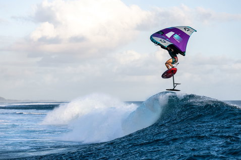 Fanatic Aero Carve foil wing set during wing foiling aerial over a wave in Mauritius