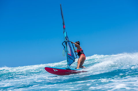 Fanatic FreeWave windsurf board during wave riding on the ocean in Maui