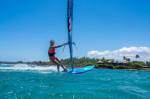 Fanatic FreeWave windsurf board during wave riding in a tropical bay in Maui