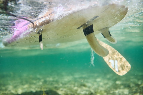 Duotone Bamboo Carbon 50 Slim SUP paddle during stand up paddling in clear ocean water in Sardinia