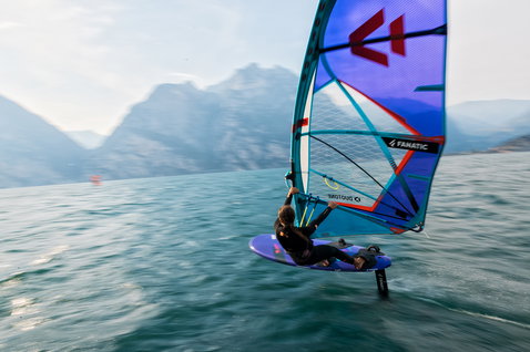 Fanatic Blast LTD windsurf foil board during wind foiling on an alpine lake with Duotone sail