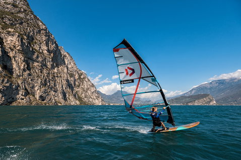 Fanatic Gecko Eco freeride windsurf board during windsurfing on a mountain lake