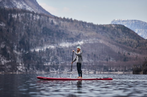 Fanatic Falcon Air Premium inflatable race SUP board during stand up paddling on an alpine lake