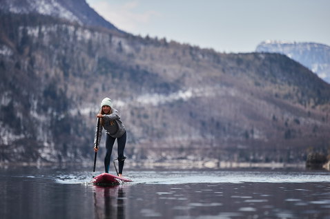 Fanatic Falcon Air Premium inflatable SUP raceboard during flatwater paddling on an alpine lake in winter