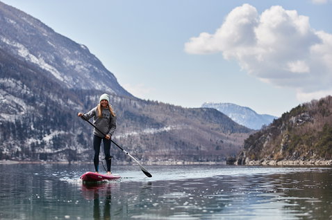 Fanatic Falcon Air Premium inflatable SUP raceboard during paddling on an alpine lake in winter