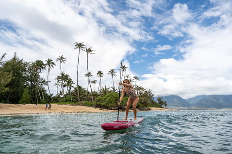 Fanatic Falcon Air Premium inflatable SUP raceboard during stand-up paddling in a tropical bay