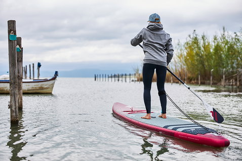 Fanatic Falcon Air Premium inflatable SUP race board during stand up paddling on a calm lake