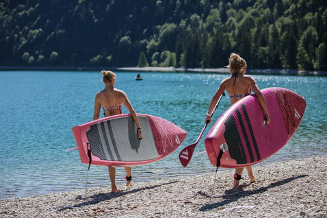 Fanatic Diamond Air Touring iSUP touring board 11'6" in pink during SUP paddling at a mountain lake