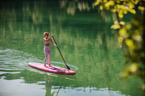 Fanatic Diamond Air Touring inflatable SUP board during touring paddle on a calm alpine lake
