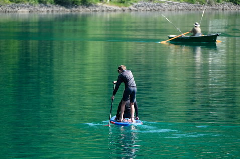 Fanatic Ripper Air SLT inflatable SUP 7'10'' during stand-up paddling on an alpine lake